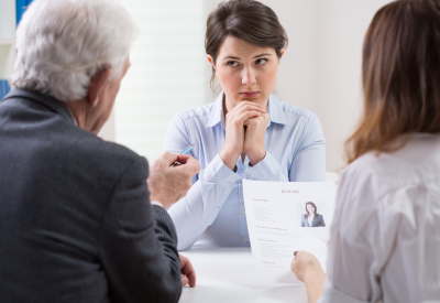 Young woman in difficult conversation with her superiors