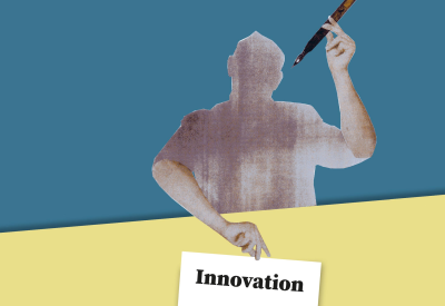 Person holds a sign with the word innovation and a fountain pen in the air