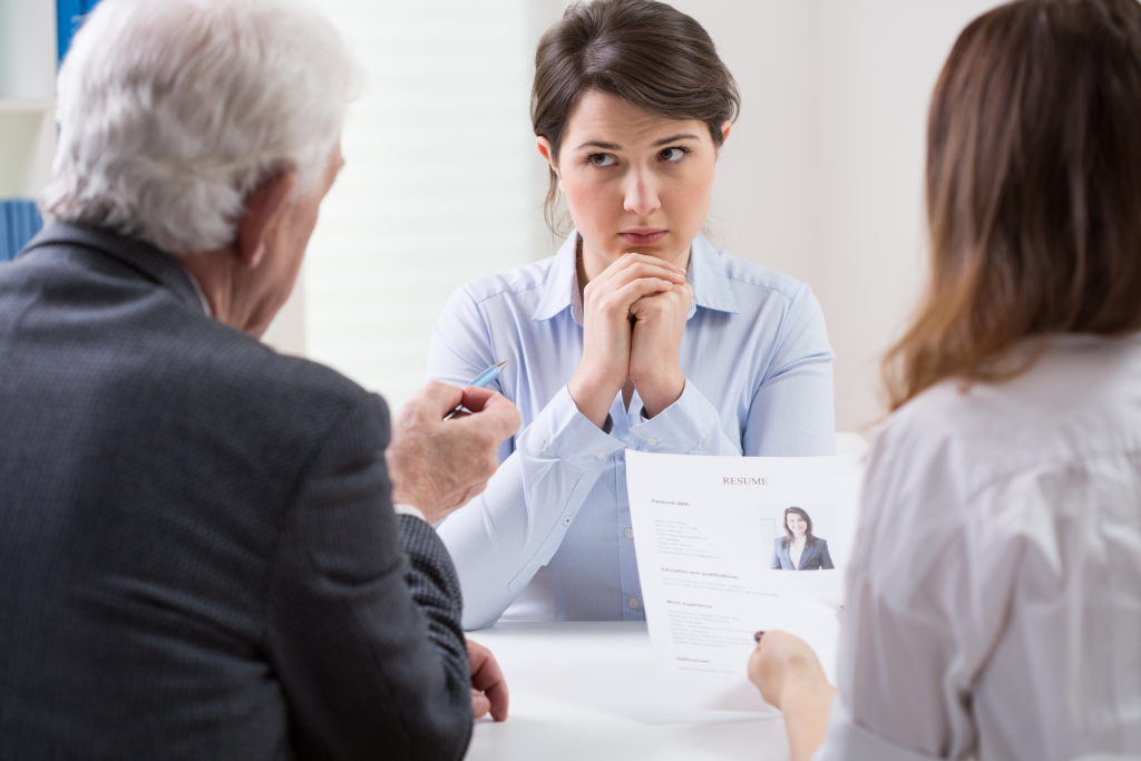 Young woman in difficult conversation with her superiors